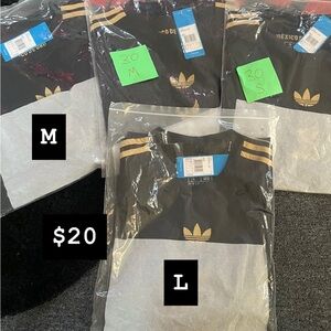 Adidas Kids Black Jersey with Gold Stripes